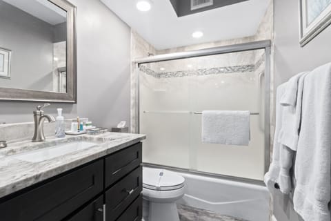 Updated Guest Bathroom with new vanity, floor and granite...