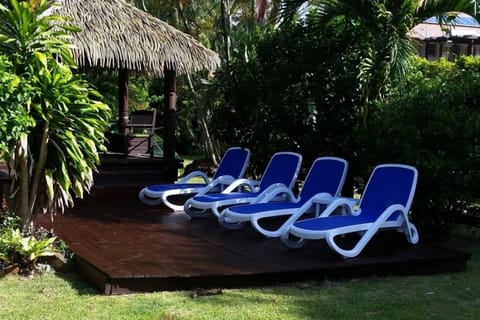 Sun loungers by the gazebo and pool