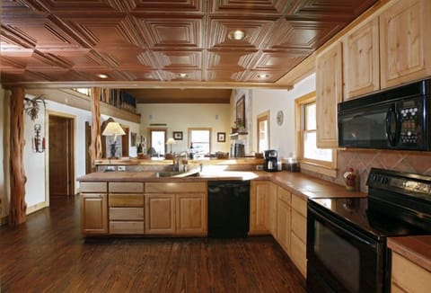 Kitchen Area oven, microwave, copper sink, refrigerator, coffe pot, dishwasher