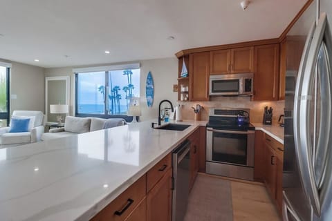 Spacious completely remodeled kitchen fully equipped for meals at home with stainless steel appliances. Brand new flooring too!