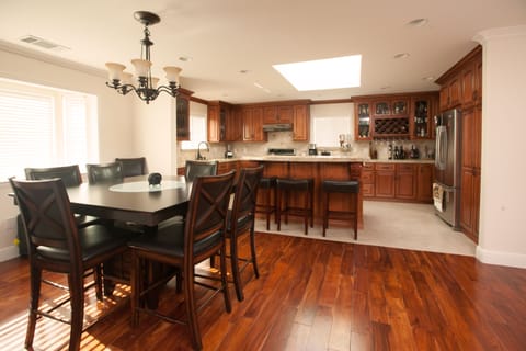 Spacious and elegant, open-concept kitchen with a large eat-in island 