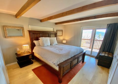 Bedroom #6 on bottom floor, King bed and access to deck