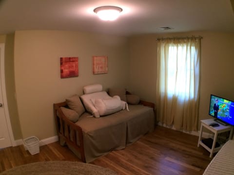 Upstairs bedroom, queen & trundle beds, dvd/blue ray player, tv, and bureau