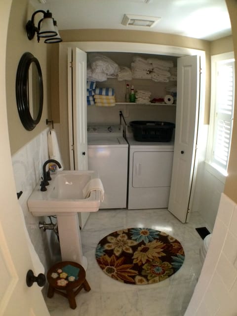 1/2 bathroom 1st level w full size washer/dryer, extra towels, linens, detergent