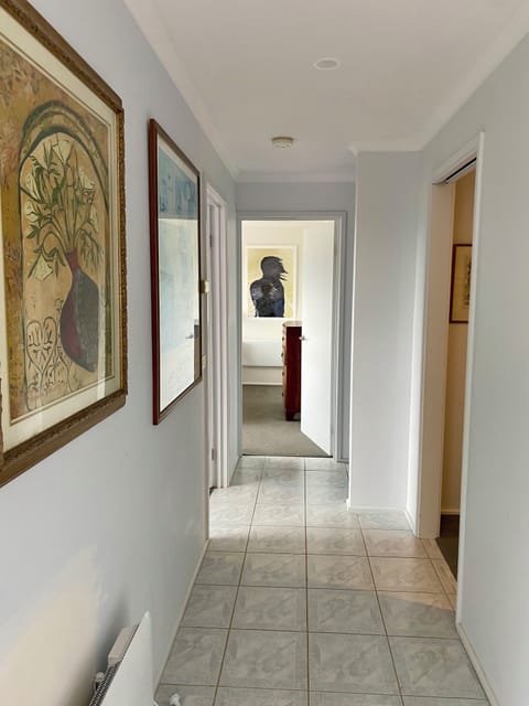 Hallway to the 3 downstairs bedrooms and bathroom.