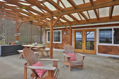 Expansive Lanai with massive wood burning fireplace, BBQ and dining area.