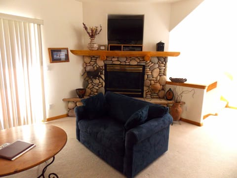 Love Seat converts to a single bed.  Gas Fireplace.