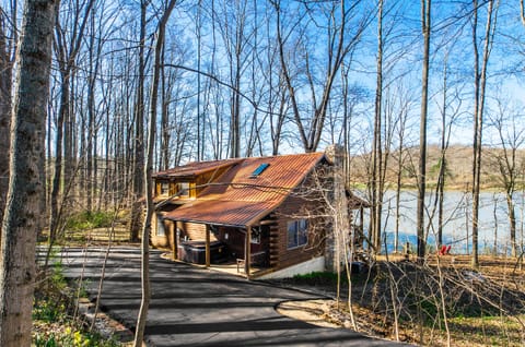 Stunning Lake Front Cabin! On 5 private acres.  Dock and steps into the water