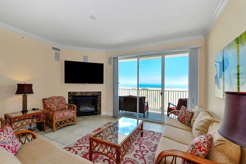 Comfortable living area with gas fireplace, flat panel TVs,  HD cable box w/ DVD player,  access to HBO, Netflix and Amazon movies. Beautiful views overlooking the beach and ocean.