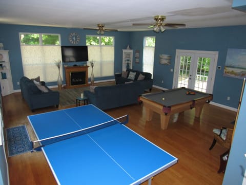 Multipurpose Room, Over Sized Windows, Fire place, 60"  TV, Tennis & Pool Tables
