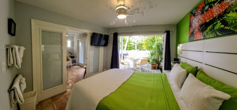 Inviting Queen bedroom with access to the deck & living area with flat screen TV