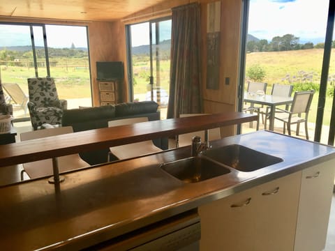 Dish washer, dble sink, fully equipped kitchen flowing to outside bbq deck area