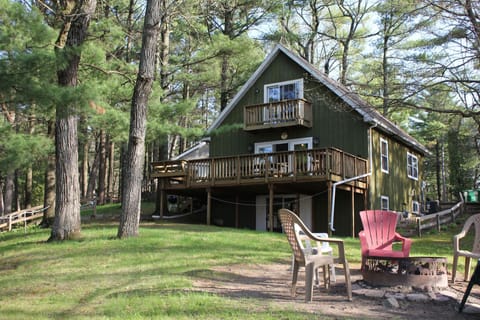 Located in the pine trees on lake delton with large main floor deck.