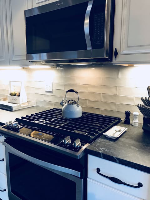 Gas stove, all stainless appliances and leathered soapstone countertops