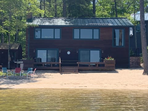 Lake Side View.  100' wide sandy beach, fire pit, kayaks and more!