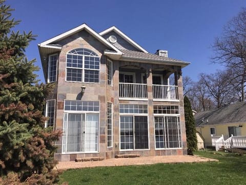 Property looks out over Wolf Lake for Scenic Views from Every Angle