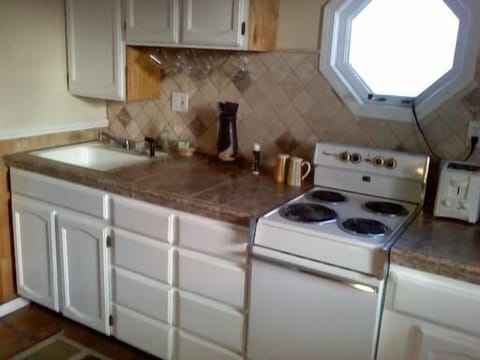 Downstairs full kitchen opens to deck and jacuzzi