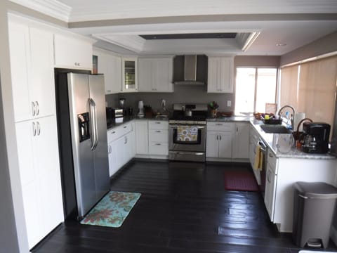 Well-appointed kitchen with 24 cf fridge and freezer & 5-burner gas range/oven.