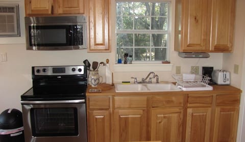 Kitchen- stove, mircowave, coffee maker and toaster. Also, pot and pans.