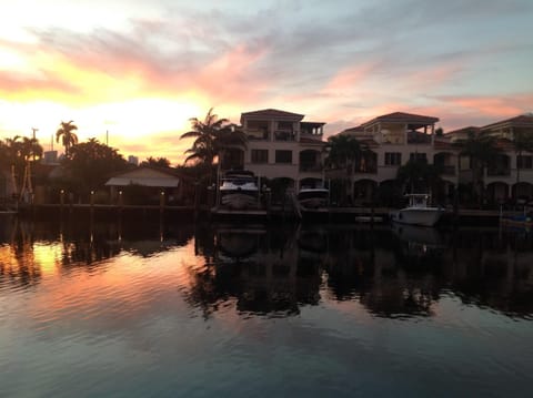 Beautiful sunset overlooking canal. Grill next to pool.  
