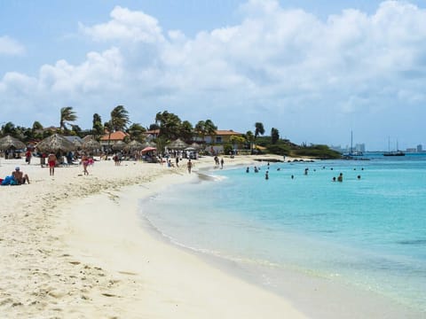 On the beach, sun loungers, beach towels