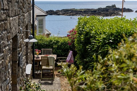 Mousehole Cottage, with private garden and sea views.