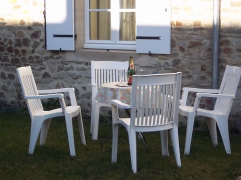 Table and chairs for drinks outside the cottage
