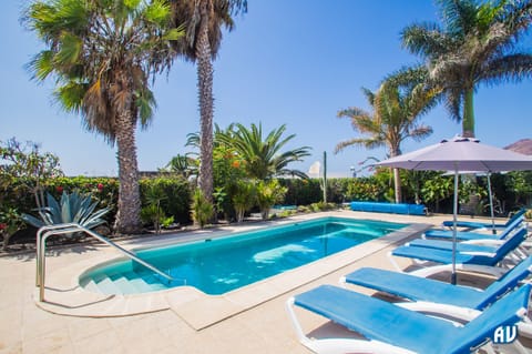 Outdoor pool, a heated pool, sun loungers