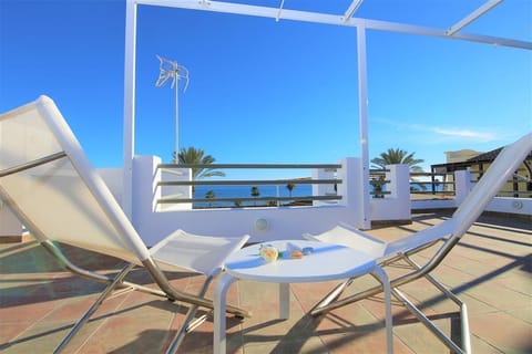 Comfortable sun loungers on the terrace