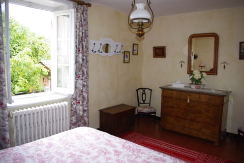 Red bedroom view of the courtyard and chestnut tree
