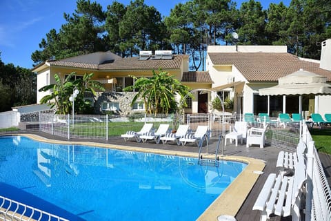 A heated pool, sun loungers