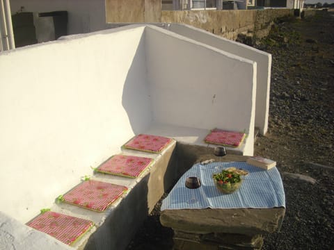 Stone table and seat at Ocean's edge