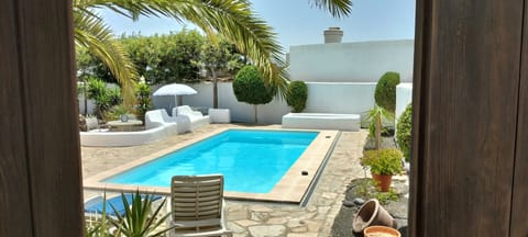 Outdoor pool, a heated pool, sun loungers