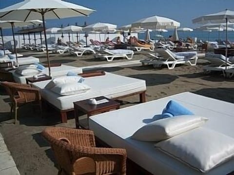 On the beach, sun loungers, beach towels