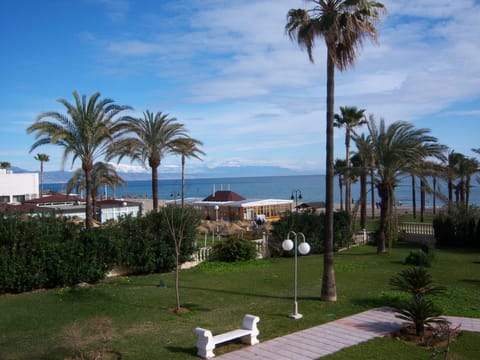 View from Balcony over gardens to Malaga bay.