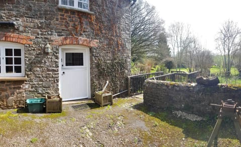 Cottage door and courtyard overlooking the grounds
