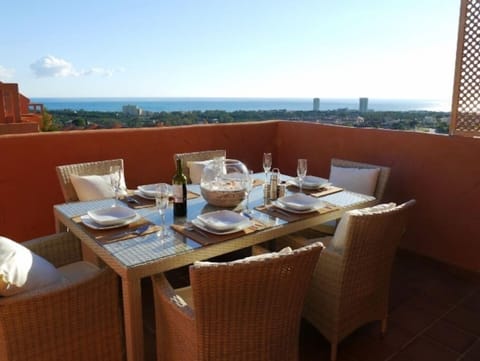 Dining on the terrace with expansive sea views,  barbeque provided on terrace.