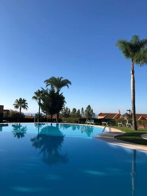 Main Pool, beautifully maintained, sea views and palm trees