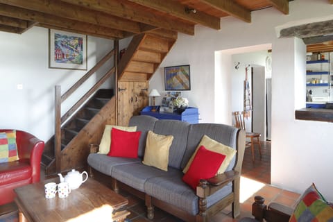 Sitting area looking towards stairs and kitchen