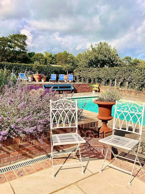 Outdoor pool, a heated pool, sun loungers