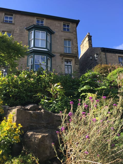 The house is set well back and high above West Road