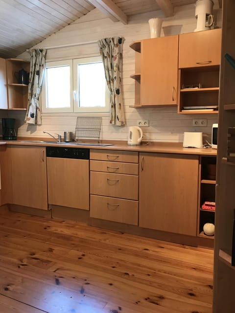 Kitchen with Dishwasher and storage cupboards