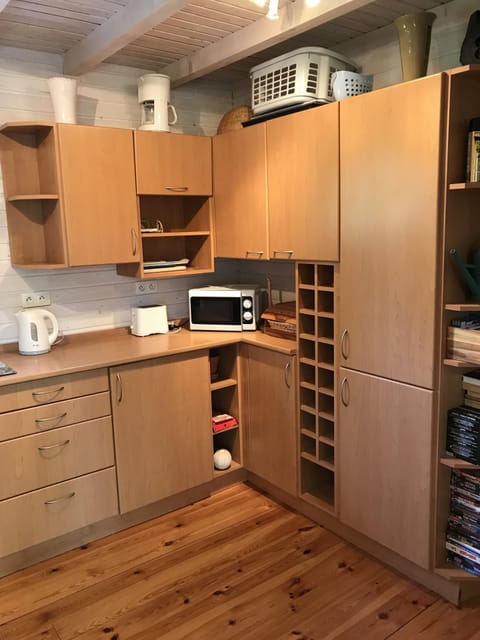 Kitchen with Toaster, Microwave, storage cupboards