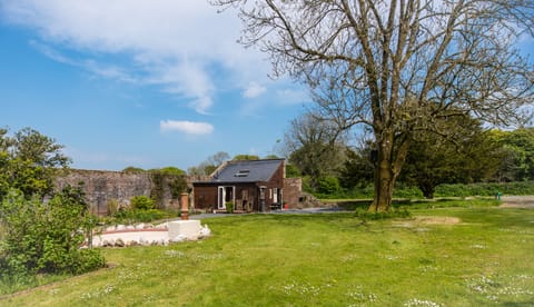 Nestled in 3/4 acre of private garden within a 3 acre Victorian Walled Garden