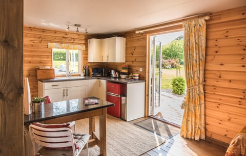 Compact but well equipped kitchen / diner with views over the gardens.