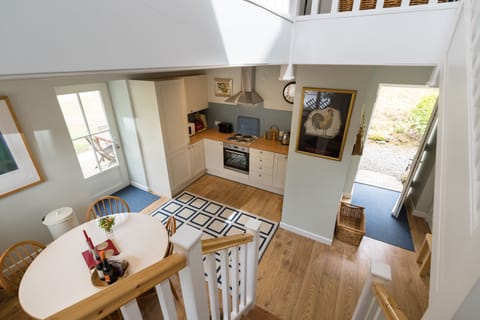 Open front door, hall, kitchen/dining of Vorlich Cottage