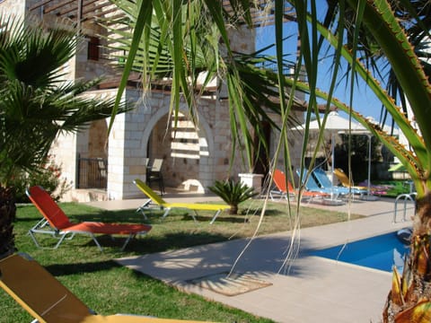 Green grass around the pool with plenty of Sun beds to Relax and enjoy the sun.