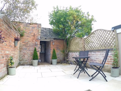 The kitchen overlooks your private terrace complete with old privy and lighting