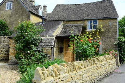 View of house from Front. Surrounded by authentic Cotswold Stone Wall.