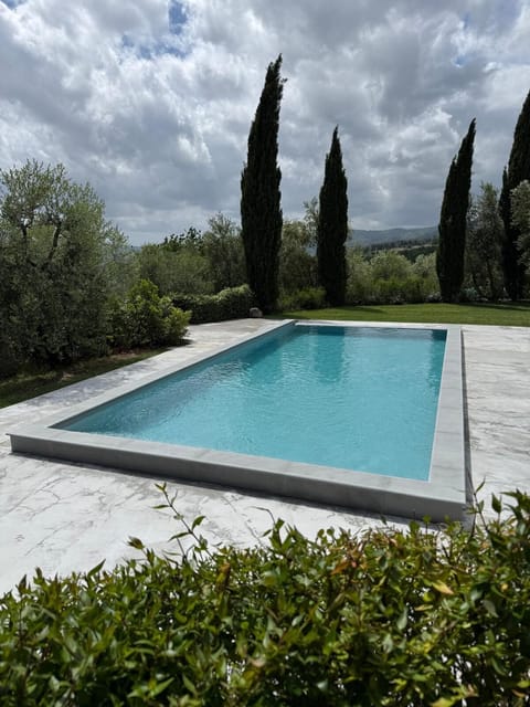 Outdoor shower is beside the pool and lovely views